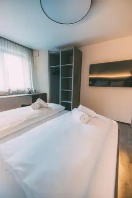 Ein Bett oder Betten in einem Zimmer der Unterkunft LIVALPIN Style