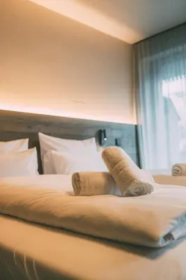 Ein Bett oder Betten in einem Zimmer der Unterkunft LIVALPIN 2Enjoy - with private Sauna