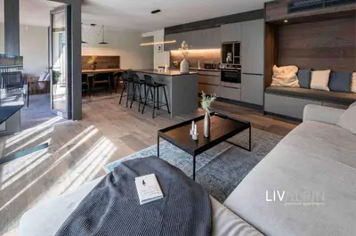 Ein Bett oder Betten in einem Zimmer der Unterkunft LIVALPIN Suite