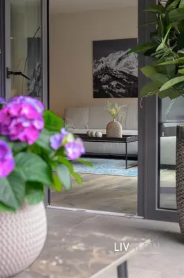 Ein Bett oder Betten in einem Zimmer der Unterkunft LIVALPIN Suite