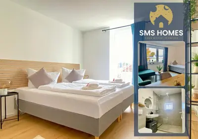 Ein Bett oder Betten in einem Zimmer der Unterkunft SMS-HOMES I Auszeit in Landsberg
