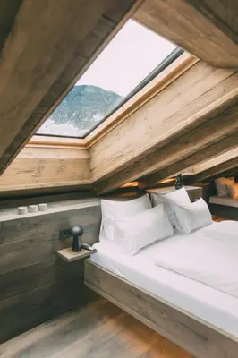 Ein Bett oder Betten in einem Zimmer der Unterkunft LIVALPIN Chalet - with private Sauna & Whirlpool
