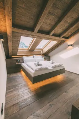 Ein Bett oder Betten in einem Zimmer der Unterkunft LIVALPIN Hideaway