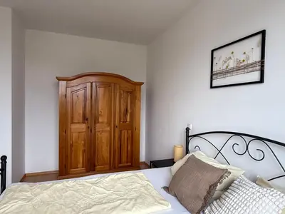 Ein Bett oder Betten in einem Zimmer der Unterkunft Ferienwohnung in Andechs am Ammersee