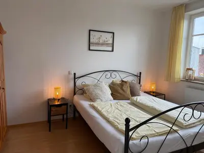 Ein Bett oder Betten in einem Zimmer der Unterkunft Ferienwohnung in Andechs am Ammersee