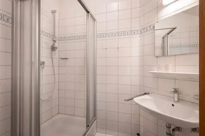 Ein Badezimmer in der Unterkunft 4 Star Maisonnette mit Kaiser Blick, Sauna, Schwimmbad