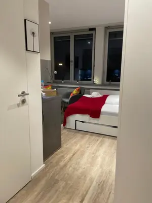 Ein Bett oder Betten in einem Zimmer der Unterkunft Modernes City-Apartment Nähe Uniklinikum und Zentrum