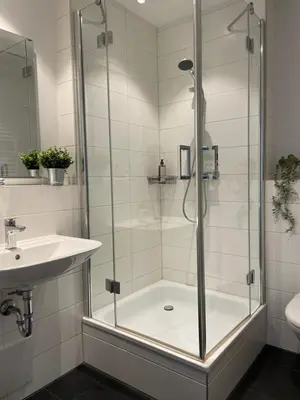 Ein Badezimmer in der Unterkunft Modernes City-Apartment Nähe Uniklinikum und Zentrum