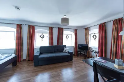 Ein Bett oder Betten in einem Zimmer der Unterkunft Königswirt Historischer Landgasthof