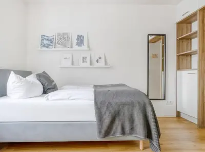 Ein Bett oder Betten in einem Zimmer der Unterkunft My Suite II - Augsburg City - Netflix