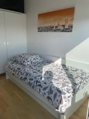 Ein Bett oder Betten in einem Zimmer der Unterkunft My Room at Munich Fair
