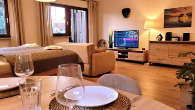 Ein Bett oder Betten in einem Zimmer der Unterkunft MADISON Homes Apartment 50 qm in Prien mit Balkon, Bergblick, Parkplatz, zentral gelegen