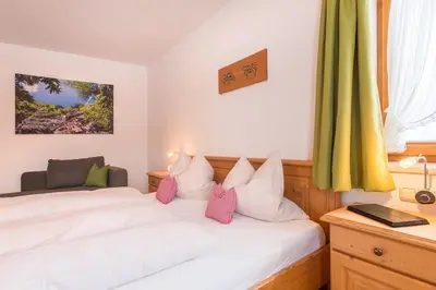Ein Bett oder Betten in einem Zimmer der Unterkunft Schusterhof Urlaub auf dem Bauernhof