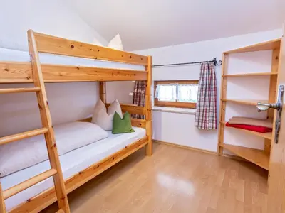 Ein Bett oder Betten in einem Zimmer der Unterkunft Schusterhof Urlaub auf dem Bauernhof