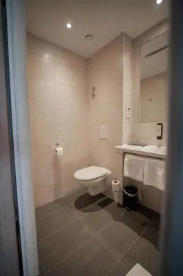 Ein Badezimmer in der Unterkunft Das Wasserburg Hotel