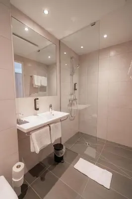 Ein Badezimmer in der Unterkunft Das Wasserburg Hotel