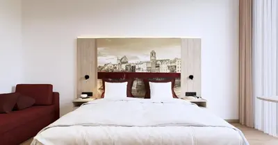 Ein Bett oder Betten in einem Zimmer der Unterkunft Das Wasserburg Hotel