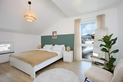 Ein Bett oder Betten in einem Zimmer der Unterkunft Ferienwohnung zum Hochgarten