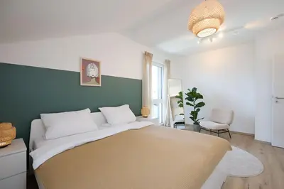 Ein Bett oder Betten in einem Zimmer der Unterkunft Ferienwohnung zum Hochgarten