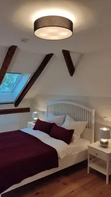Ein Bett oder Betten in einem Zimmer der Unterkunft Ferienwohnung am alten Kino
