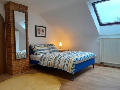 Ein Bett oder Betten in einem Zimmer der Unterkunft Ferienwohnung GEORG in Utting am Ammersee
