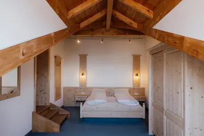 Ein Bett oder Betten in einem Zimmer der Unterkunft ALPENHOF Westerbuchberg