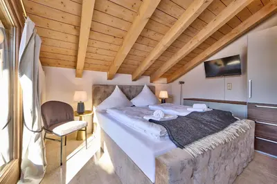 Ein Bett oder Betten in einem Zimmer der Unterkunft Ludwig'sLodge