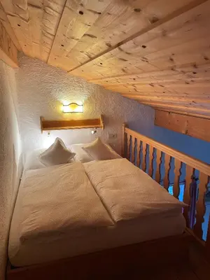 Ein Bett oder Betten in einem Zimmer der Unterkunft Ferienwohnung Theresia Oberm, Kreuth-Enterbach
