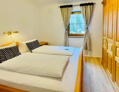 Ein Bett oder Betten in einem Zimmer der Unterkunft Ferienwohnung 'Breitenstein' am Schliersee