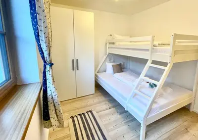 Ein Bett oder Betten in einem Zimmer der Unterkunft Ferienwohnung 'Breitenstein' am Schliersee