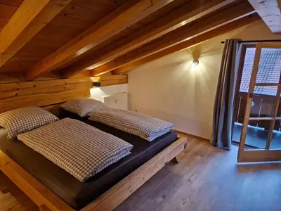 Ein Bett oder Betten in einem Zimmer der Unterkunft Das Bergnest