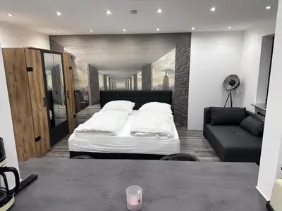 Ein Bett oder Betten in einem Zimmer der Unterkunft Wohnung im Herzen von München