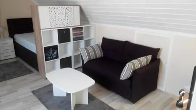 Ein Sitzbereich in der Unterkunft 1 Zimmer Apartment mit Kochecke und Bad