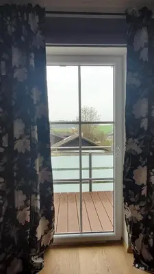 Ein Balkon oder eine Terrasse in der Unterkunft Super Ferienwohnung mit zwei Schlafzimmern und Fitnessraum süd-östlich von München