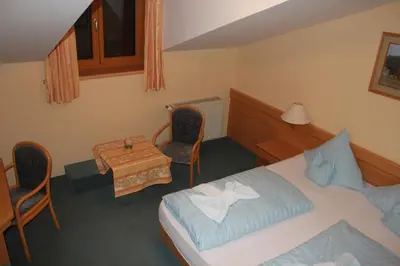 Ein Bett oder Betten in einem Zimmer der Unterkunft Landgasthaus & Hotel Kurfer Hof