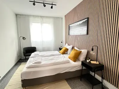 Ein Bett oder Betten in einem Zimmer der Unterkunft LTA Apartment München Süd No3 Friends & Family