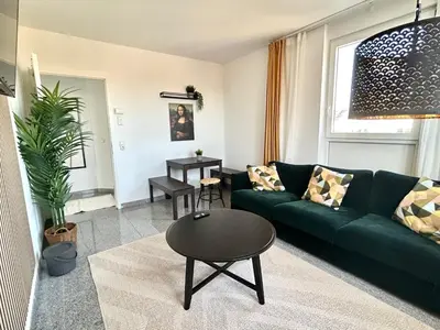 Ein Sitzbereich in der Unterkunft LTA Apartment München Süd No3 Friends & Family