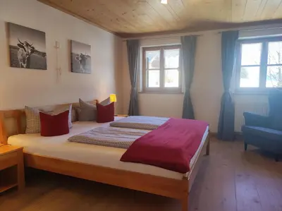Ein Bett oder Betten in einem Zimmer der Unterkunft Ferienhof beim Bohlar - Geiselstein