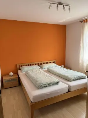 Ein Bett oder Betten in einem Zimmer der Unterkunft Ferienwohnung Schütz