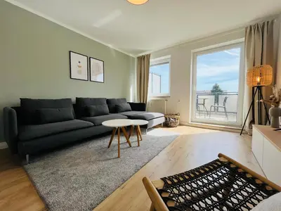 Ein Sitzbereich in der Unterkunft Modern 2-Bedroom Apartment Near Messe 2-4 Guests