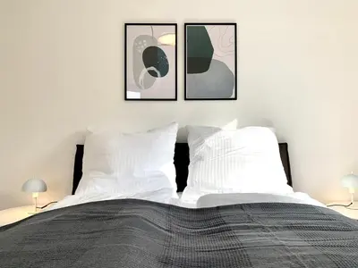 Ein Bett oder Betten in einem Zimmer der Unterkunft Modern 2-Bedroom Apartment Near Messe 2-4 Guests