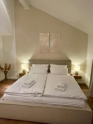 Ein Bett oder Betten in einem Zimmer der Unterkunft Munich Penthouse with Kitchen, Roofgarden and Parking