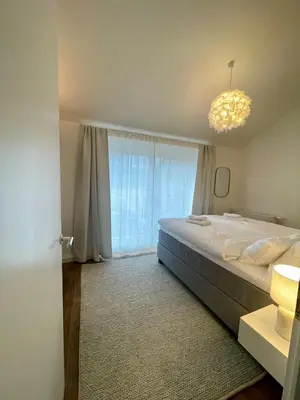 Ein Bett oder Betten in einem Zimmer der Unterkunft Munich Penthouse with Kitchen, Roofgarden and Parking