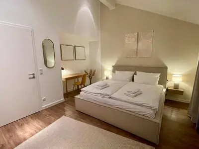 Ein Bett oder Betten in einem Zimmer der Unterkunft Munich Penthouse with Kitchen, Roofgarden and Parking
