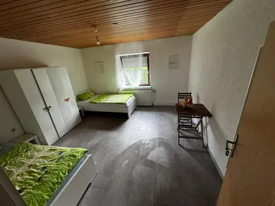 Ein Bett oder Betten in einem Zimmer der Unterkunft Wohlfühlhaus Adelsried