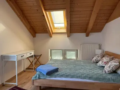 Ein Bett oder Betten in einem Zimmer der Unterkunft Ferienhaus Alpspitze