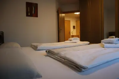 Ein Bett oder Betten in einem Zimmer der Unterkunft ciao-aschau FeWo Chiemgau Gastner