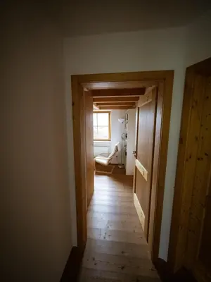 Ein Bett oder Betten in einem Zimmer der Unterkunft Haus Schwänli mit Kachelofen und Sauna