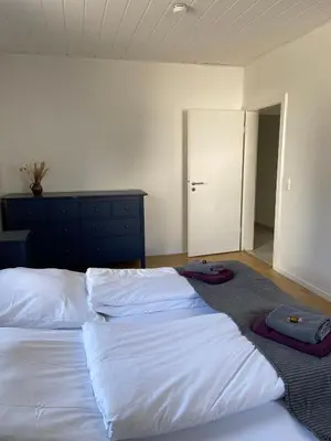 Ein Bett oder Betten in einem Zimmer der Unterkunft Apartment mit 3 Schlafzimmern im Erdgeschoss