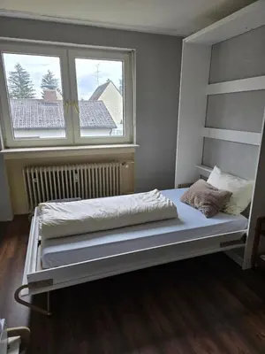 Ein Bett oder Betten in einem Zimmer der Unterkunft Wohnung in München